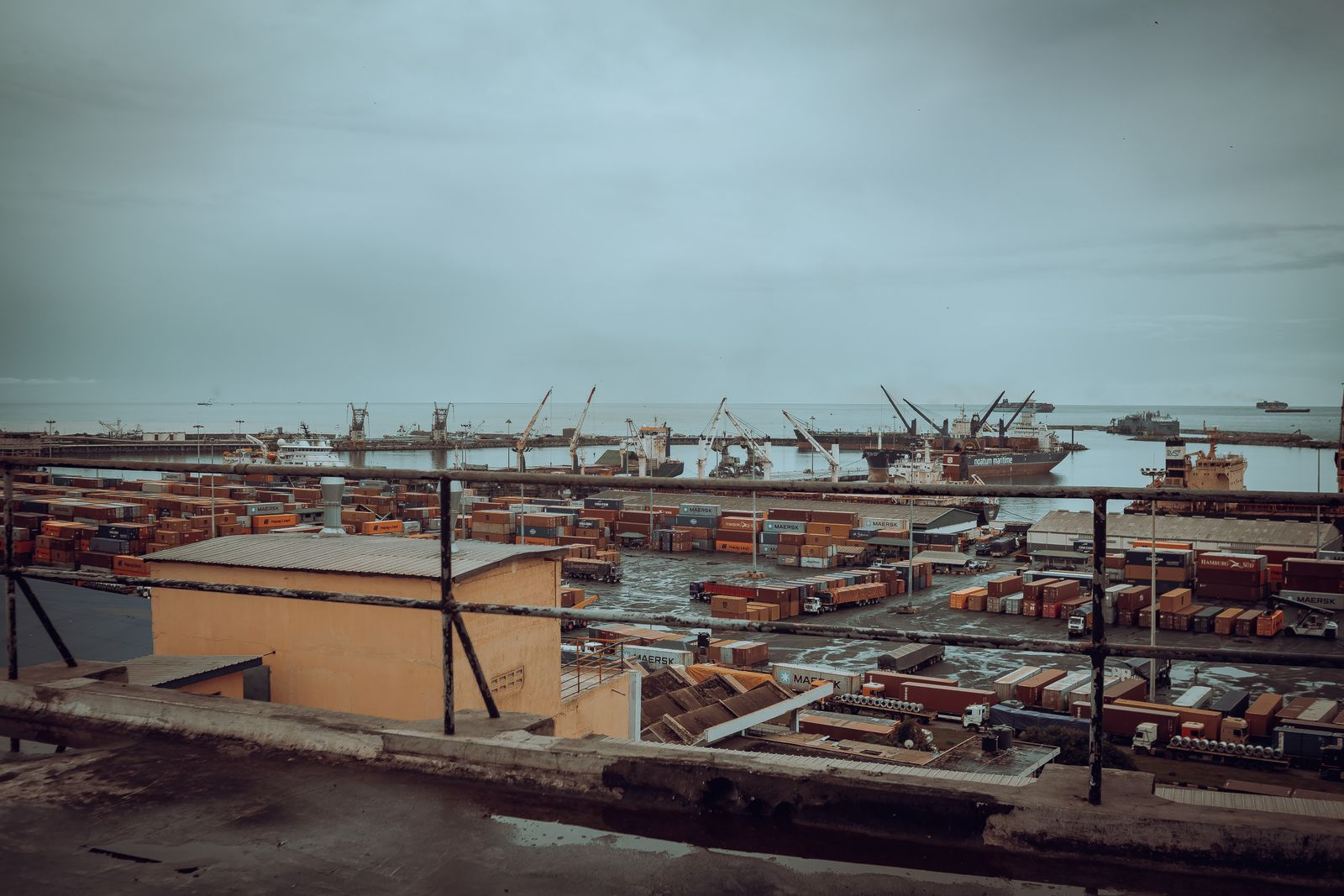 Shipping containers and port cranes at Tema Port, Ghana